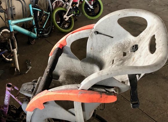 Did RIOC Abandon Its Abandoned Bike Policy? A left behind child seat is the only seat left on this bike.